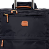 Bric's X-Collection checked 30-inch spinner luggage with durable fabric and four wheels for easy travel.