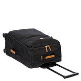 Bric's X-Collection checked 30-inch spinner luggage with durable wheels and retractable handle, featuring a stylish checked pattern.