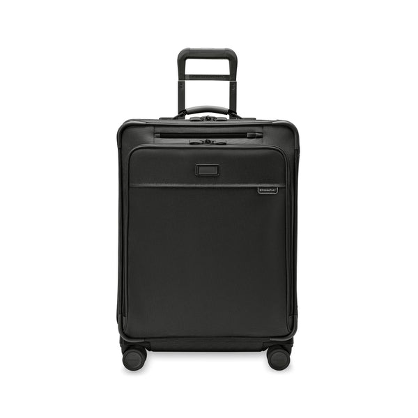 Briggs & Riley Baseline medium expandable spinner suitcase with four wheels and blue color, showing its sleek design and sturdy handle.
