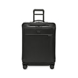 Briggs & Riley Baseline medium expandable spinner suitcase with four wheels and blue color, showing its sleek design and sturdy handle.