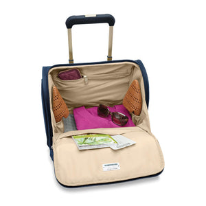 Briggs & Riley Baseline 2-wheel carry-on luggage in blue with telescopic handle and four spinner wheels for easy travel.