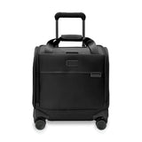 Briggs & Riley Baseline cabin spinner carry-on luggage in blue with four wheels and a telescopic handle, viewed from the side.