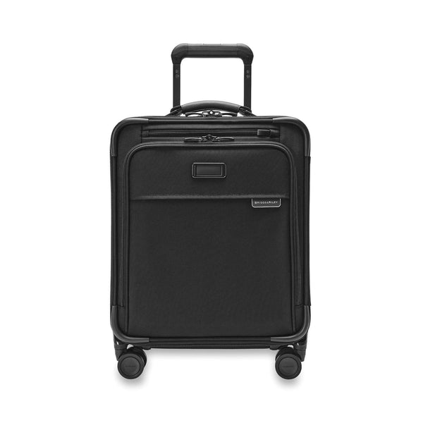 Blue Briggs & Riley Baseline compact carry-on spinner luggage with four wheels and telescoping handle.