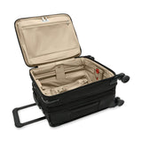 Briggs & Riley Baseline compact carry-on spinner luggage with blue hard shell, four wheels, and telescopic handle.