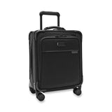 Blue Briggs & Riley Baseline compact carry-on spinner luggage with four wheels and retractable handle, ready for travel.