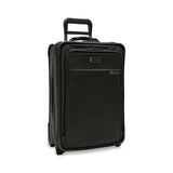 Briggs & Riley Baseline Essential 2-Wheel Carry-On Luggage in blue with telescopic handle and four spinner wheels.