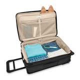 Briggs & Riley Baseline Essential 2-Wheel Carry-On Luggage in blue with sturdy wheels and sleek design for travel.