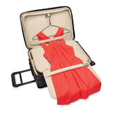 Briggs & Riley Baseline Essential 2-Wheel Carry-On luggage in blue with a sleek hard shell and telescoping handle.