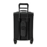 Briggs & Riley Baseline Essential Carry-On Spinner luggage in blue with four wheels and a sturdy telescoping handle.
