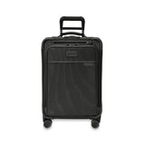 Blue Briggs & Riley Baseline Essential Carry-On Spinner luggage with four wheels and telescoping handle for easy travel.