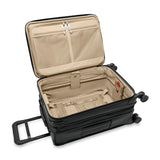 Briggs & Riley Baseline Essential Carry-On Spinner luggage in blue with four wheels and telescoping handle, lightweight and durable design.