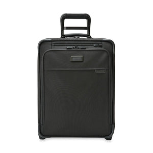 Briggs & Riley Baseline Global 2-Wheel Carry-On luggage in blue with four-wheeled design and durable hard-shell exterior.