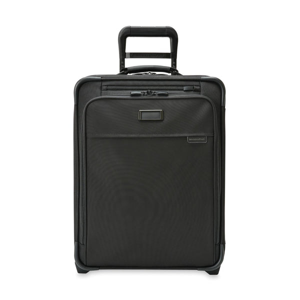 Briggs & Riley Baseline Global 2-Wheel Carry-On luggage in blue with four-wheeled design and durable hard-shell exterior.