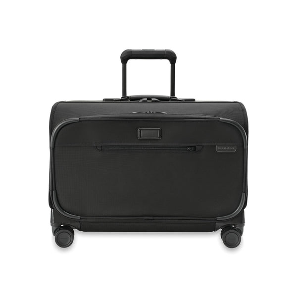 Briggs & Riley Baseline wide carry-on wheeled garment spinner with blue exterior, four spinner wheels, and telescoping handle.