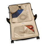 Briggs & Riley Baseline wide carry-on wheeled garment spinner suitcase with navy blue exterior and four spinner wheels.