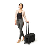 Briggs & Riley Baseline wide carry-on wheeled garment spinner luggage in blue with four spinner wheels and a telescoping handle.