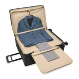 Briggs & Riley Baseline extra large expandable spinner checked luggage with blue hard shell and four wheels, open to show interior compartments.
