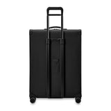 Briggs & Riley Baseline extra large expandable checked luggage spinner in blue with four wheels and a sturdy handle.