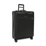 Briggs & Riley Baseline large expandable checked luggage spinner with blue hard shell and four wheels for easy travel.
