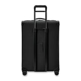 Briggs & Riley Baseline large expandable checked luggage with blue hard shell, four spinner wheels, and telescoping handle.