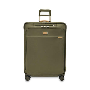 Briggs & Riley Baseline large expandable checked luggage spinner in blue with four wheels and a telescopic handle.