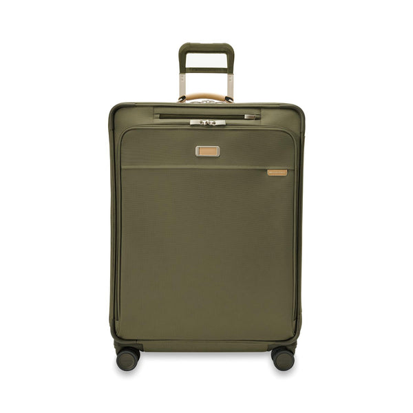 Briggs & Riley Baseline large expandable checked luggage spinner in blue with four wheels and a telescopic handle.