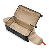 Briggs & Riley Torq extra large checked luggage trunk with spinner wheels, durable hard shell, and secure locking system.