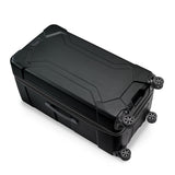 Briggs & Riley Torq extra large checked luggage trunk spinner with hard shell and multiple compartments on smooth spinner wheels.