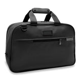 Briggs & Riley Baseline Executive Travel Duffle bag in black with leather handles and multiple zipper compartments.