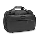 Briggs & Riley Baseline expandable cabin bag duffel with wheels, black nylon exterior, and handle for travel convenience.