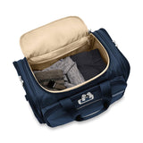 Briggs & Riley Baseline underseat duffle bag with black fabric and handles, designed for travel and easy packing.