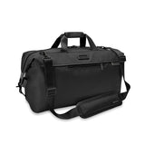 Briggs & Riley Baseline Weekender Duffle bag in black with carrying handles and zippered pockets, displayed on a flat surface.