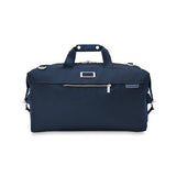 Briggs & Riley Baseline Weekender Duffle bag in black with leather accents, showing its spacious design and sturdy handles.