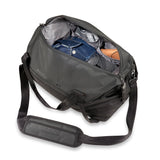 Briggs & Riley ZDX Cargo Satchel duffle bag with sturdy handles and zippered compartments, made of durable material.