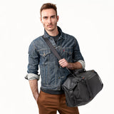 Briggs & Riley ZDX Cargo Satchel duffle bag with sturdy handles and exterior pockets, black nylon material, and compact design.