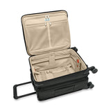 Blue Briggs & Riley Baseline Global Carry-On Spinner luggage with four wheels and telescoping handle for easy travel.