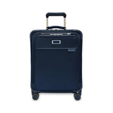 Blue Briggs & Riley Baseline Global Carry-On Spinner luggage with four wheels and sturdy telescopic handle.