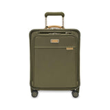 Blue Briggs & Riley Baseline Global Carry-On Spinner luggage with four wheels and telescoping handle, open to show interior compartments.