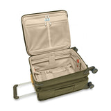 Blue Briggs & Riley Baseline Global Carry-On Spinner luggage with four wheels and telescoping handle, designed for travel.