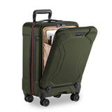 Briggs & Riley Torq international carry-on spinner suitcase with four wheels and telescoping handle, black hard-shell exterior.