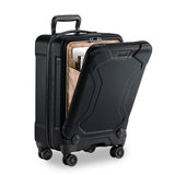 Briggs & Riley Torq international carry-on spinner with four wheels, hard shell exterior, and telescoping handle for easy travel.