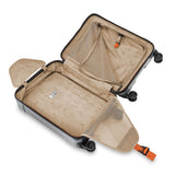 Briggs & Riley Torq international carry-on spinner suitcase with four wheels, black hard-shell exterior, and telescopic handle.