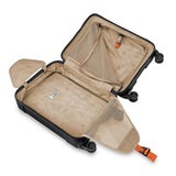 Briggs & Riley Torq international carry-on spinner with four wheels, sleek black hard shell and extended telescoping handle.