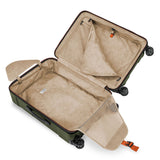 Briggs & Riley Torq medium spinner suitcase in black with four wheels and telescoping handle for easy travel.