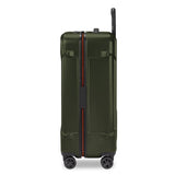 Black Briggs & Riley Torq medium spinner suitcase with four wheels and telescopic handle, designed for easy travel.