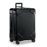 Briggs & Riley Torq medium spinner suitcase in stealth black with four wheels and sturdy handle, designed for travel durability.