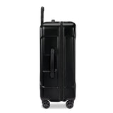 Briggs & Riley Torq medium spinner suitcase in stealth black with four wheels and a sturdy handle for easy travel.