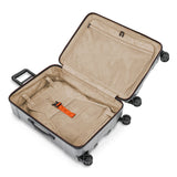 Briggs & Riley Torq medium spinner suitcase in sleek black with four rotating wheels and a sturdy handle.