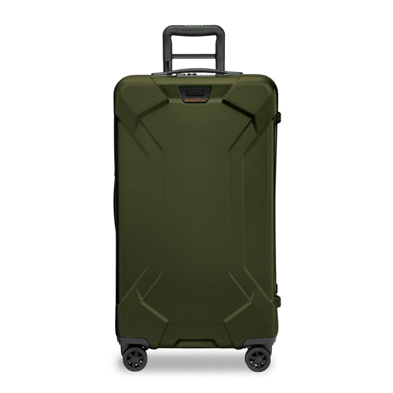 Briggs & Riley Torq medium black trunk spinner with four wheels and telescoping handle for easy travel.