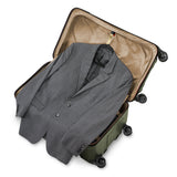 Briggs & Riley Torq medium trunk spinner in stealth black with four multi-directional wheels and durable hard shell exterior.